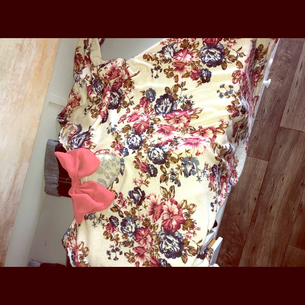 Floral lightweight sweater with pink bow on back.